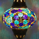 Lit close-up of mosaic glass globe — Blue table lamp glowing (ENV MUN3032)