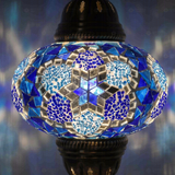Lit close-up of mosaic glass globe — Blue table lamp glowing (ENV MUN3034)