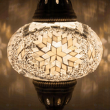 Lit close-up of mosaic glass globe — White table lamp glowing (ENV MUN3043)