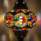 Lit close-up of mosaic glass globe — Multicolor table lamp glowing (ENV MUN3047)