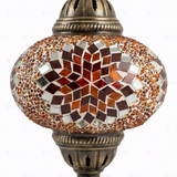 Close-up of Amber warm amber mosaic glass globe pattern — table lamp (ENV MUN3065)