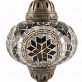 Close-up of Amber warm amber mosaic glass globe pattern — table lamp (ENV MUN3067)
