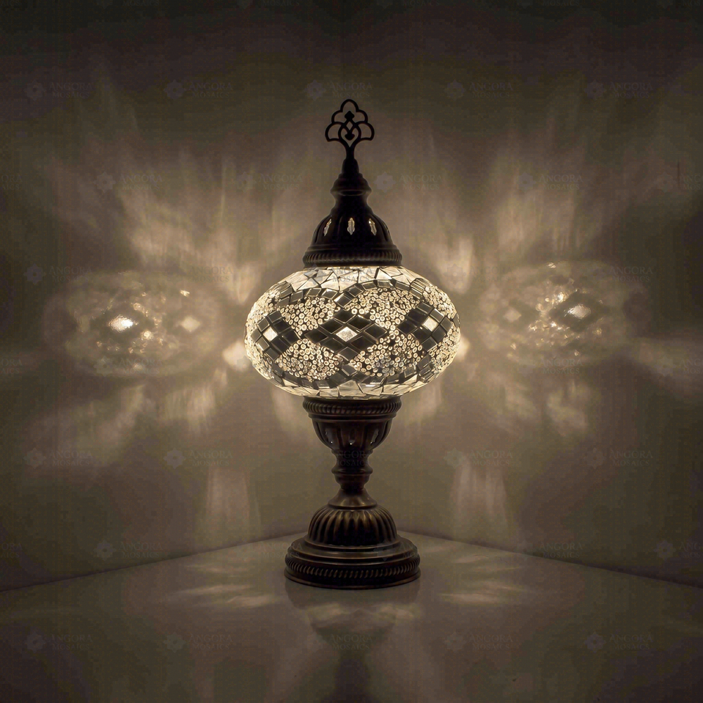 White Classic Table Lamp, glowing in a dark room