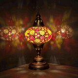 Amber Turkish mosaic table lamp illuminated, showing colorful light projection (ENV MUN3079)