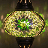 Lit close-up of mosaic glass globe — Green table lamp glowing (ENV MUN3096)