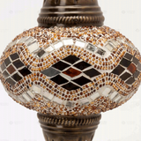 Close-up of Amber warm amber mosaic glass globe pattern — table lamp (ENV MUN3097)