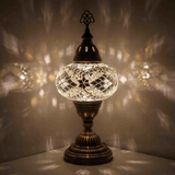 White Turkish mosaic table lamp illuminated, showing colorful light projection (ENV MUN3098)