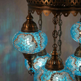 Lit close-up of mosaic glass globe — Blue chandelier glowing (ENV SLT5N3 (3016))