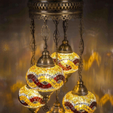 Lit close-up of mosaic glass globe — Amber chandelier glowing (ENV SLT5N3 (3064))