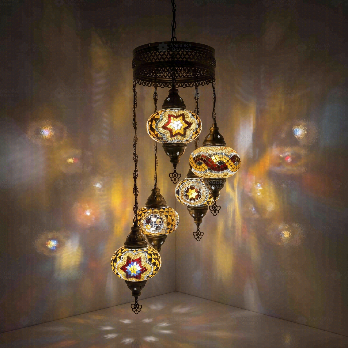 Multicolor 5-Globe Spiral Chandelier, switched on, glowing in a dark room