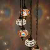 Lit close-up of mosaic glass globe — Warm Tones chandelier glowing (HLZ7N3 (3018X4-3068X3))