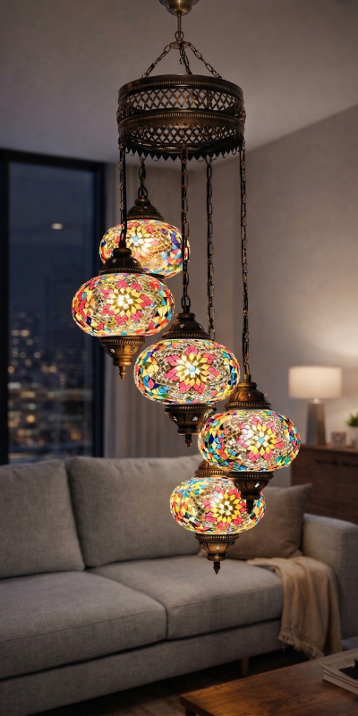 A five-globe mosaic chandelier lit above a sofa